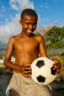 Smiling young with football