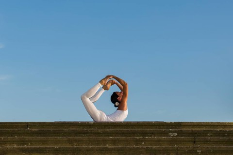Young woman practising Hatha yoga