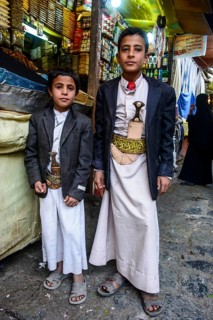 Two boys with their djambas at the spice market in the old city