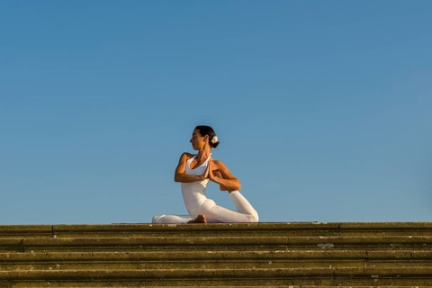 Young woman practising Hatha yoga