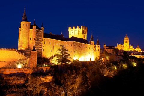 Alcazar fortress and cathedral at dusk