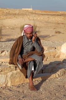 Jordanian in traditional dress on a mobile phone