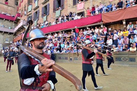 Cross-bow bearer at the parade before the historical horse race Palio di Siena