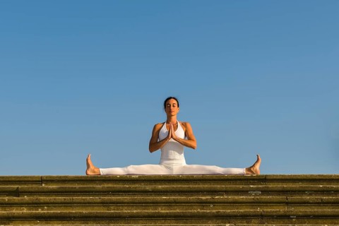Young woman practising Hatha yoga
