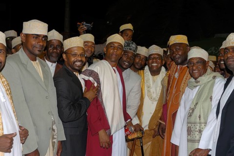 Friendly Comoran men at a traditional wedding of a rich man