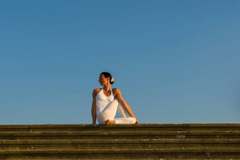 Young woman practising Hatha yoga