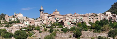 Valldemossa with the Carthusian Valldemossa Charterhouse and the parish church of Sant Bartomeu