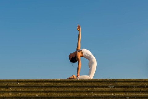 Young woman practising Hatha yoga