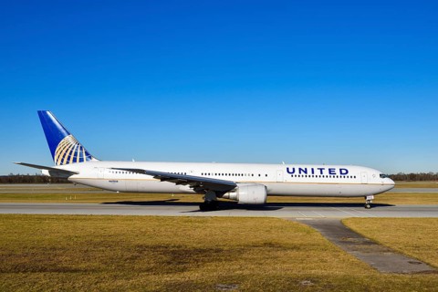United Airlines Boeing B 767 rolling on the taxiway towards runway