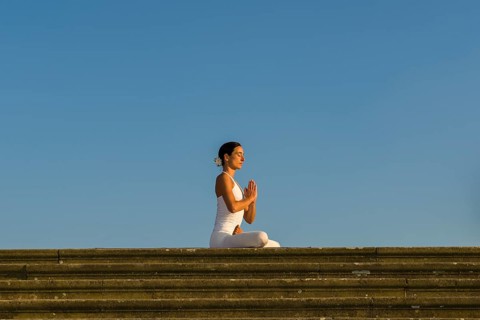 Young woman practising Hatha yoga