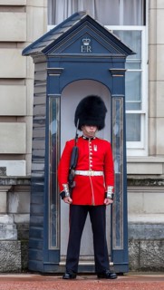 Guard of the Royal Guard with bearskin in front of Buckingham Palace