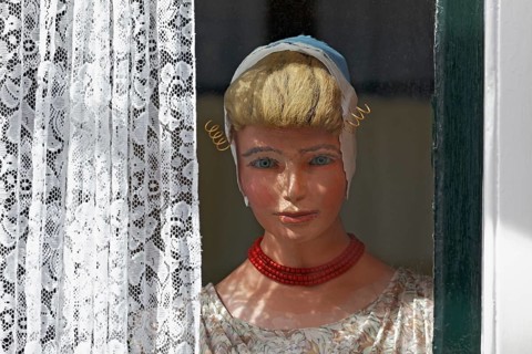 Display dummy in Dutch traditional costume in a window