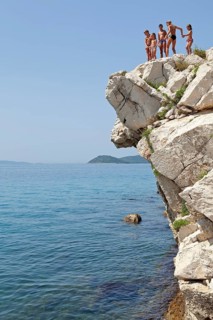 Children standing on cliff