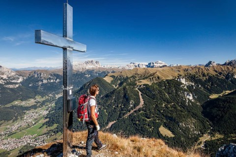 Mountaineer on the summit of Cima Dodici