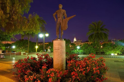Statue of the bullfighter Pepe Luis Vazquez on the promenade of the Rio Guadalquivir