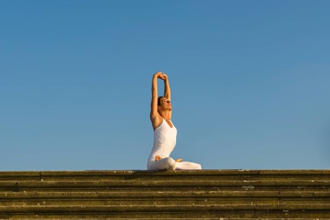 Young woman practising Hatha yoga