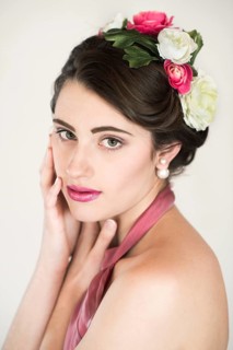 Beauty portrait of a young woman with flowers in her hair