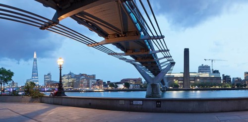 Millennium Bridge from below with views of The Shard skyscraper and Tate Modern