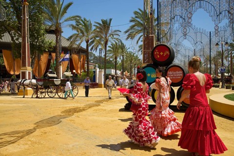Women in flamenco dresses at the Feria del Caballo