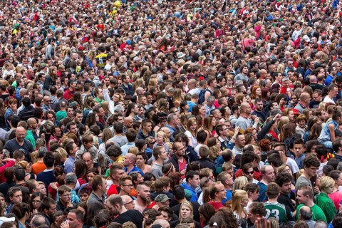 Densely packed crowd at a public festival