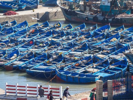 Old blue fishing boats in the port of Essaouira