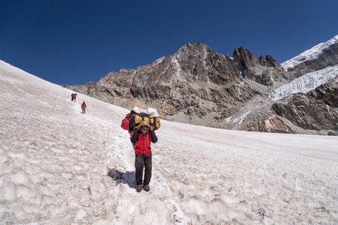 Carrier descending from the Cho La pass over snow field