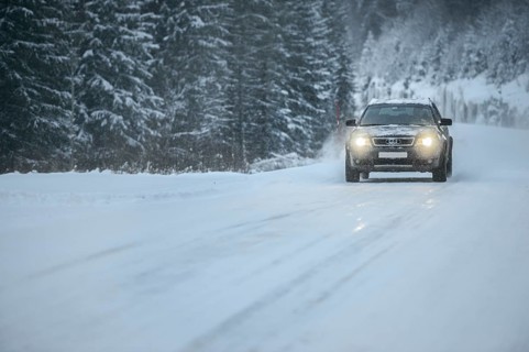 Truck driving on snowy road