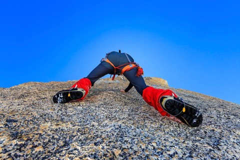 Climber climbing on a rock wall