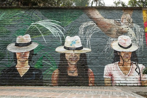 Painting of two men and a woman wearing Panama hats