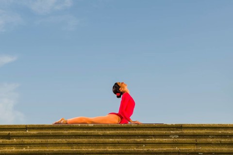 Young woman practising Hatha yoga