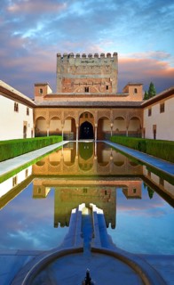 Arabesque Moorish architecture and pond of the Court of the Myrtles of the Palacios Nazaries
