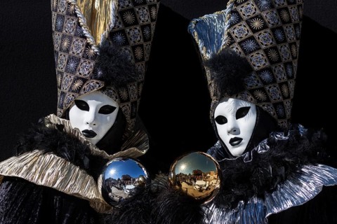 Venetian Carnival masks and costumes at the Venetian Fair on the historic market square