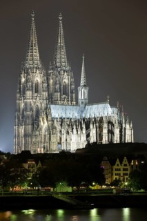 The Cologne Cathedral illuminated at night with Rhine