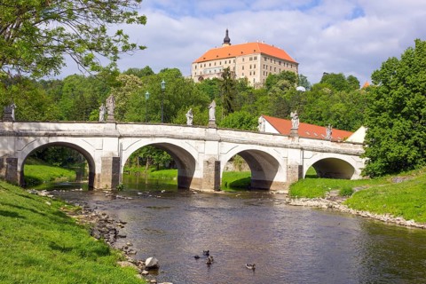 Baroque bridge with statues of Joseph Winterhalder and Namest nad Oslavou Chateau