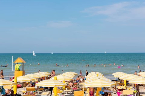 Bathers and parasols on the beach