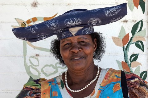Local Herero woman wearing typical headdress and dress