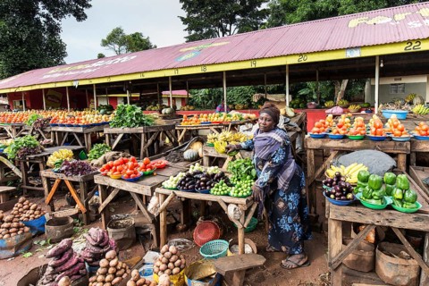 A woman selling vegetables on a street market