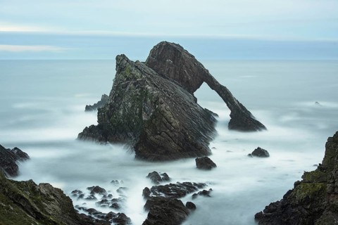 Quartzite sea arch at dusk