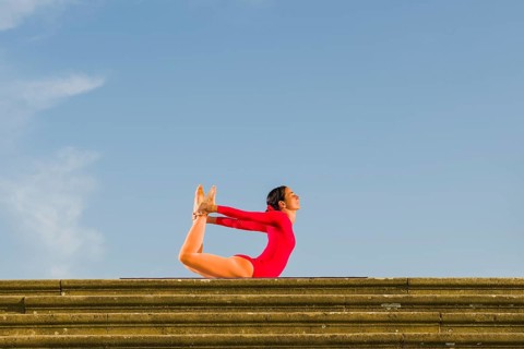 Young woman practising Hatha yoga
