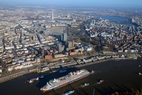 Cruise ship Queen Victoria on the Elbe in front of the city center with television tower and Alster