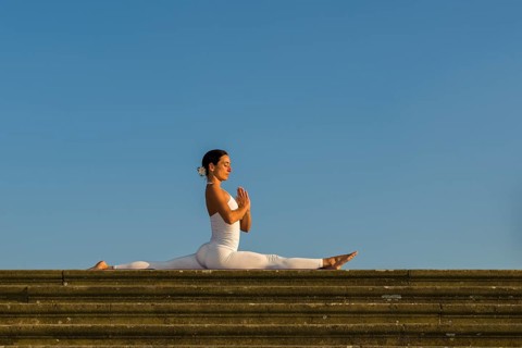 Young woman practising Hatha yoga