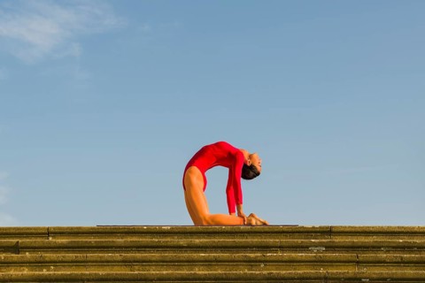 Young woman practising Hatha yoga