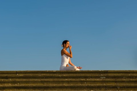 Young woman practising Hatha yoga