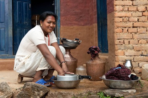 Nepalese woman doing the dishes