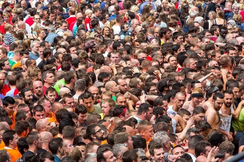Densely packed crowd at a public festival