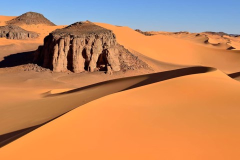The sand dunes and rocks of Moul Naga