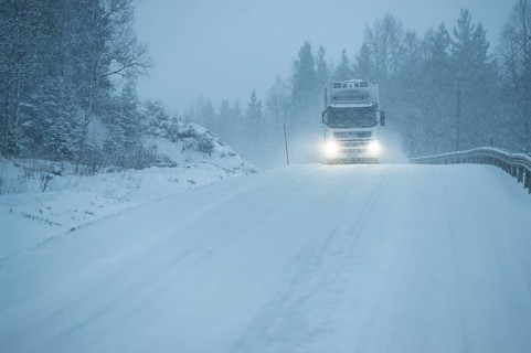 Truck driving on snowy road