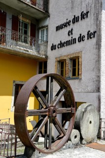 Iron wheel and grinding stones at the entrance to the Iron and Railway Museum