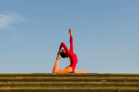 Young woman practising Hatha yoga