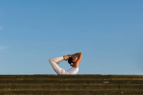 Young woman practising Hatha yoga